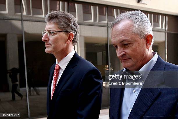 Robert Kaluza, a well site manager for BP Plc during the 2010 explosion on board the Deepwater Horizon oil rig, right, arrives at federal court with...