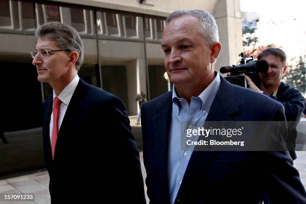 Robert Kaluza, a well site manager for BP Plc during the 2010 explosion on board the Deepwater Horizon oil rig, right, arrives at federal court with...