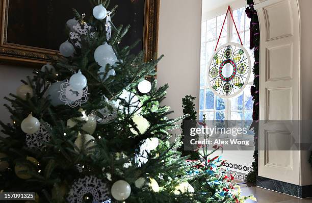 Stained glass window, created by Chicago-based artist David Lee Csicsko, is on display at the East Wing during a preview of the 2012 White House...