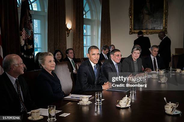 President Barack Obama, center, speaks during a meeting with members of his cabinet at the White House in Washington, D.C., U.S., on Wednesday, Nov....