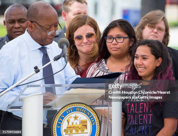 Mayor Sylvester Turner reads a proclamation to the family of Lesha Adams, shown from left, Stephanie Marsh, Olivia Adams-Marsh and Ava Marsh, during...