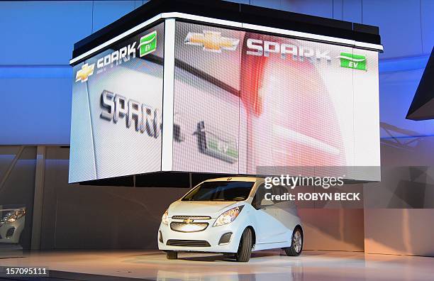 The 2013 Chevrolet Spark EV all electrical car is unveiled at the Los Angeles Auto Show in Los Angeles, California on media preview day, November 28,...