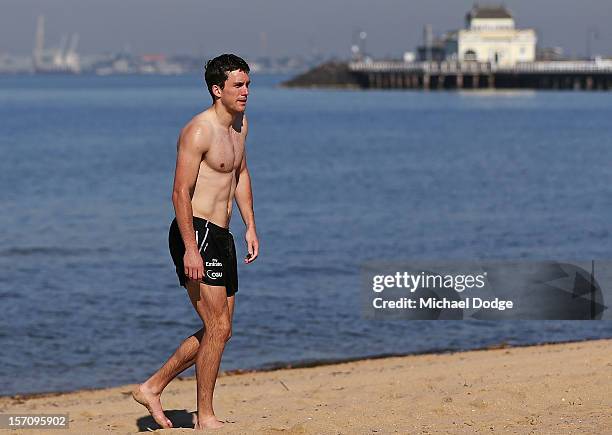 New recruit Clinton Young walks along the beach during a Collingwood Magpies AFL training session at St Kilda Sea Baths on November 29, 2012 in...