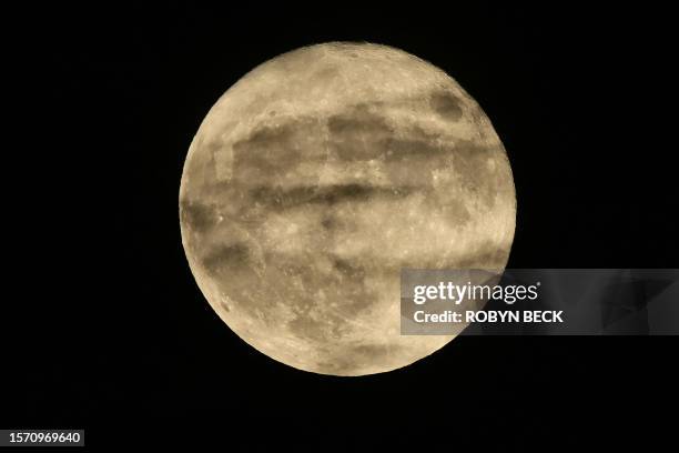 The Sturgeon super moon rises in Glendale, California on August 1, 2023.