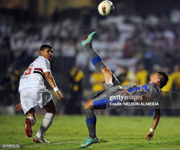 Kevin Harbottle of Chile’s Universidad Catolica, kicks the ball during their 2012 Copa Sudamericana semifinal football match against Brazil's Sao...