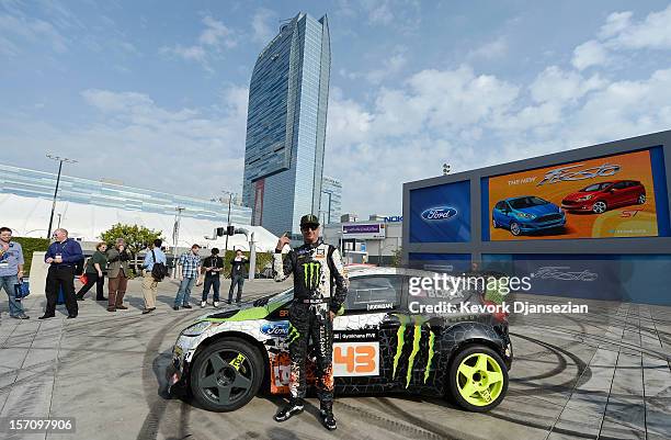 Race car driver Ken Block, a professional rally driver with the Monster World Rally Team, stands in front of the Ford three-cylinder Fiesta at the...