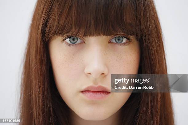 a close-up portrait of a young woman staring - one teenage girl only imagens e fotografias de stock