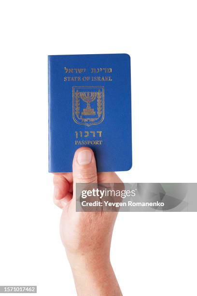 israel passport in hand isolated on white background - israeli passport stock pictures, royalty-free photos & images