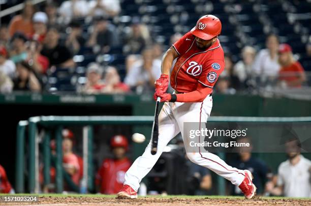 Jeimer Candelario of the Washington Nationals drives in a run with a double in the eighth inning against the Colorado Rockies at Nationals Park on...