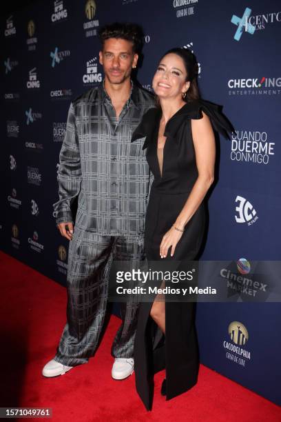 Erick Elías and Ana Claudia Talancón pose for photos during the red carpet for the movie 'Cuando Duerme Conmigo' at Cinemark on July 25, 2023 in...
