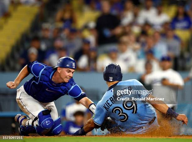 Will Smith of the Los Angeles Dodgers makes the out against Kevin Kiermaier of the Toronto Blue Jays in the tenth inning at Dodger Stadium on July...