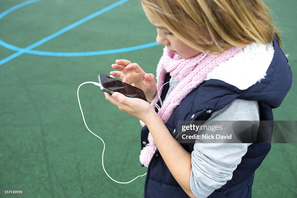 Girl listening to music on mobile