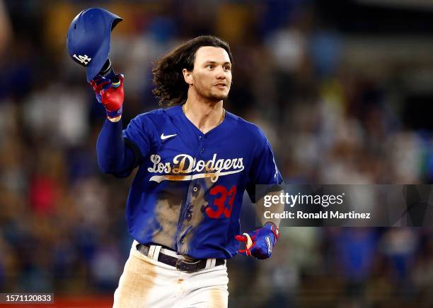 James Outman of the Los Angeles Dodgers drives in the game winning run against the Toronto Blue Jays in the tenth inning at Dodger Stadium on July...