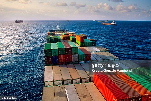 container ship transporting goods. - ship stock pictures, royalty-free photos & images