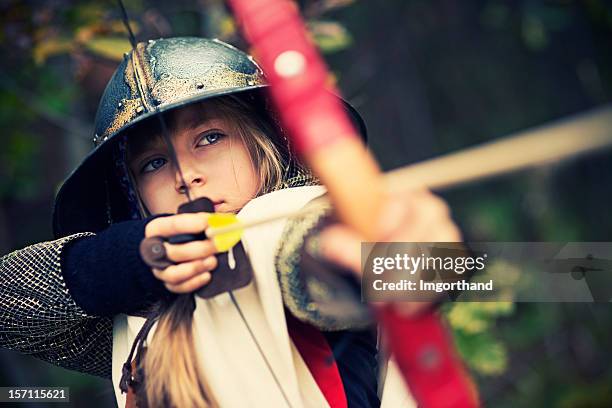 little archer in woods - bow arrow stock pictures, royalty-free photos & images