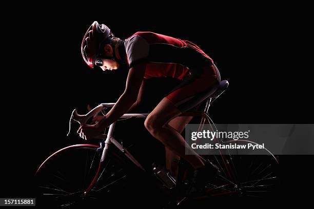 cyclist on black background - bicicleta de corrida imagens e fotografias de stock