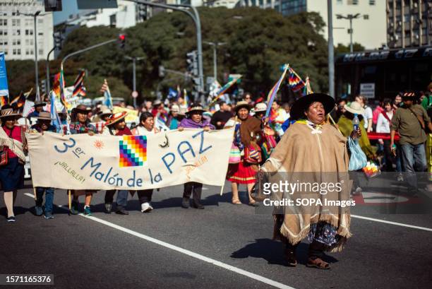 Indigenous protesters march with banners, flags, and placards during a demonstration on the occasion of "La Pachamama," or Mother Earth Day....