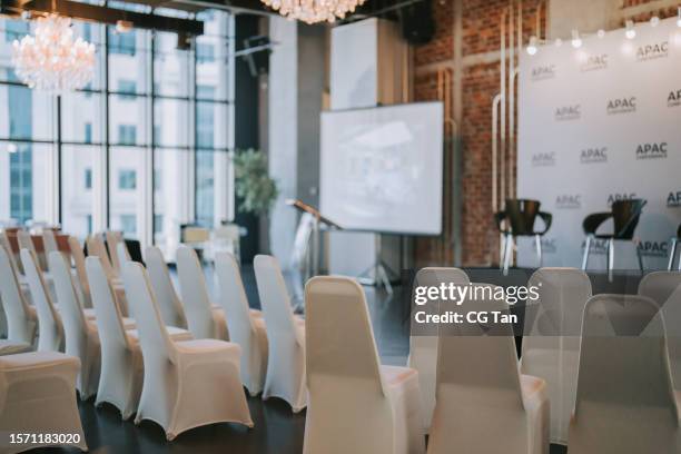 seminar conference workshop event backdrop, stage , projector screen, podium, chairs - shareholders meeting stock pictures, royalty-free photos & images