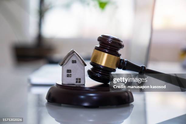 house with gavel. real estate law and house auction concept. - bankruptcy lawyer stock pictures, royalty-free photos & images