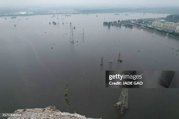An aerial view shows a flooded area after heavy rains on the outskirts of Beijing, in the border area between Beijing and Hebei province, on August...