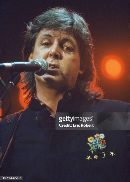 Paul McCartney with his band Wings performing on stage at Palais Omnisport de Bercy.