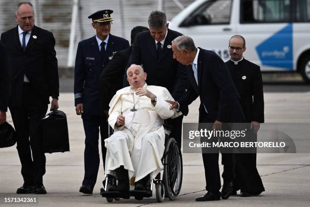 Pope Francis speaks with Portuguese President Marcelo Rebelo de Sousa after landing at the Figo Maduro air base in Lisbon to attend the World Youth...