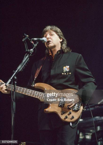 Paul McCartney with his band Wings performing on stage at Palais Omnisport de Bercy.