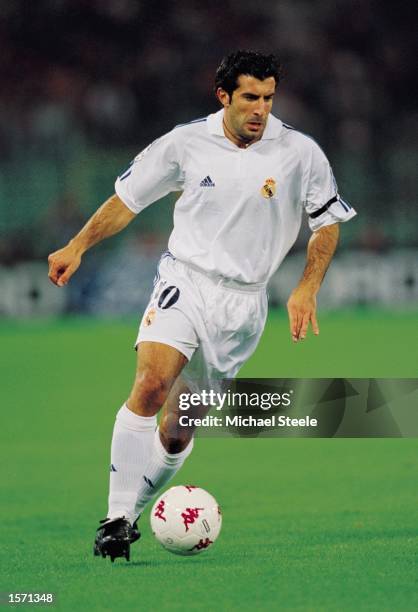 Luis Figo of Real Madrid runs with the ball during the UEFA Champions League Group A match against AS Roma played at the Stadio Olimpico, in Rome,...