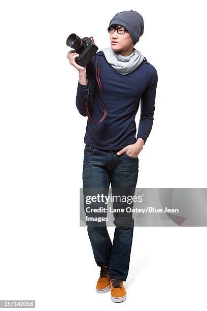 cool young photographer with camera - walking toward camera stock pictures, royalty-free photos & images