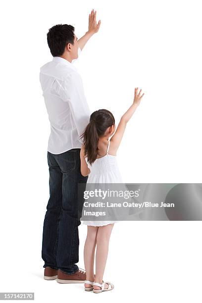 father and daughter waving to the front - blue shirt back stock pictures, royalty-free photos & images