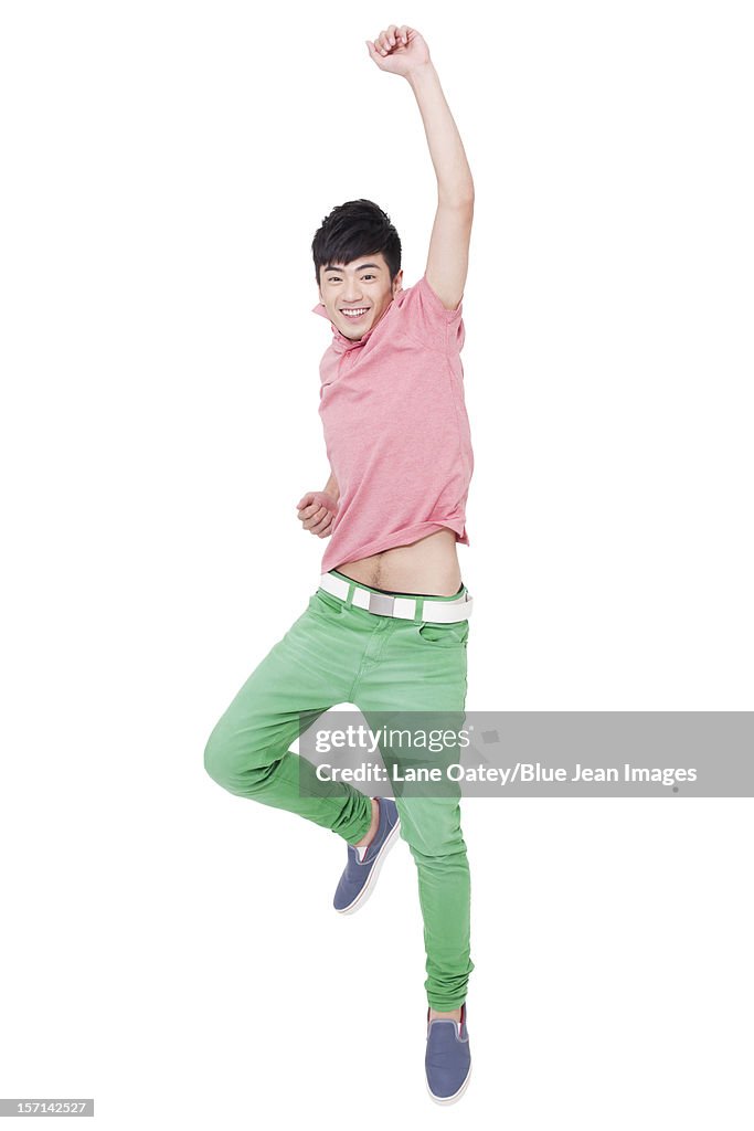 Happy young man jumping