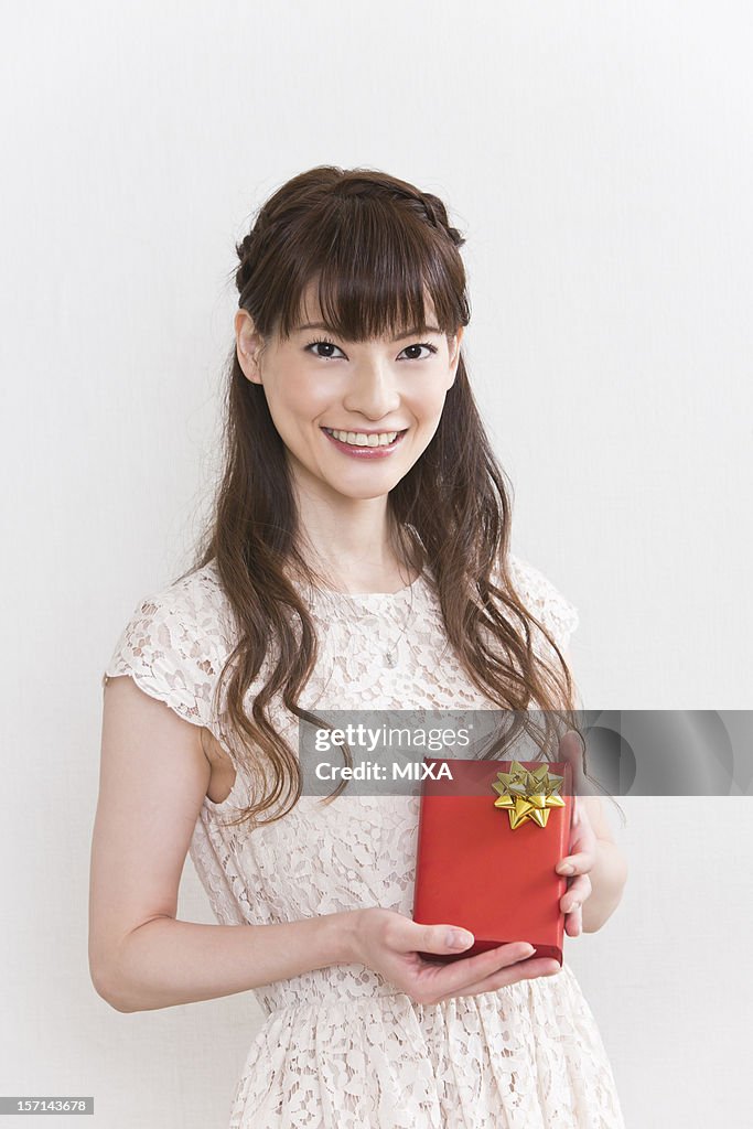 Young Woman Holding Gift Box