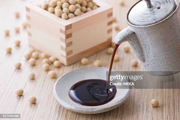 soy sauce and soybean - soy sauce stock pictures, royalty-free photos & images