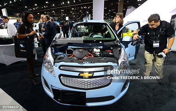 The new Chevrolet Spark EV eco-friendly car from General Motors attracts interest on media preview day at the Los Angeles Auto Show on November 28,...
