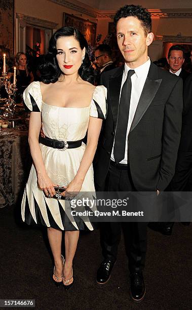 Dita Von Teese and Andrew Armsrong attend a dinner celebrating the launch of 'Valentino: Master Of Couture', the new exhibition showing at Somerset...