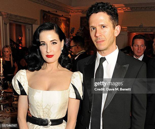 Dita Von Teese and Andrew Armsrong attend a dinner celebrating the launch of 'Valentino: Master Of Couture', the new exhibition showing at Somerset...