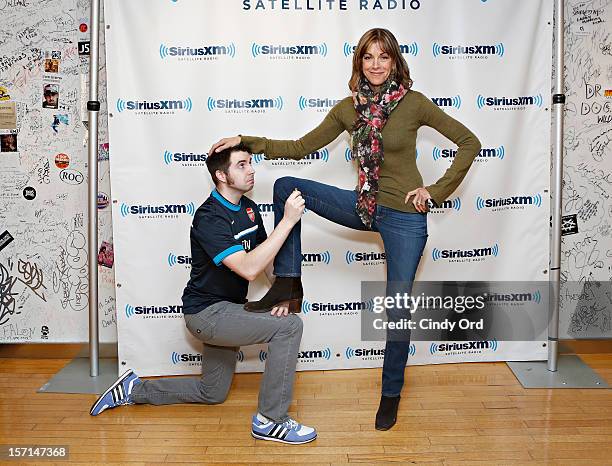 SiriusXM host Mark Seman poses with actress Wendie Malick at the SiriusXM Studios on November 28, 2012 in New York City.