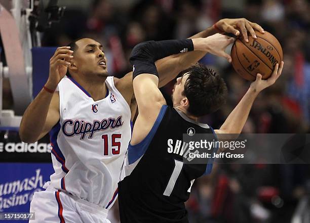 Alexey Shved of the Minnesota Timberwolves is blocked by Ryan Hollins of the Los Angeles Clippers in the second half at Staples Center on November...