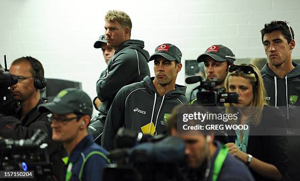 Australian Test cricketers join a packed media conference as their teammate Ricky Ponting announces his retirement on the eve of the third cricket...