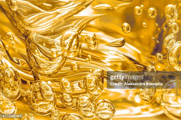 yellow bubble oil or serum, transparent smudged gel texture - gel de cabelo imagens e fotografias de stock