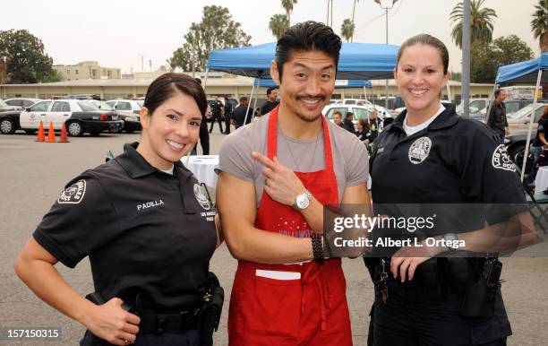 Actor Brian Tee participates in the Hollywood Chamber of Commerce's annual police and firefighters appreciation day at the Hollywood LAPD station on...