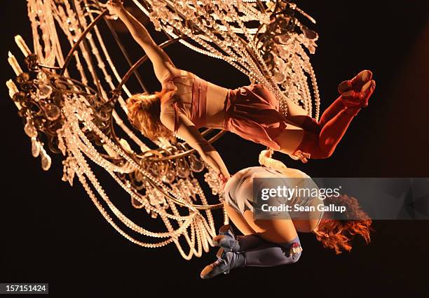 Acrobats swing on a chandelier during the Corteo production at the Cirque Du Soleil circus dress rehearsal on November 28, 2012 in Berlin, Germany....