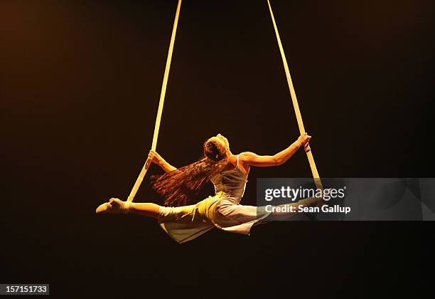 An acrobat performs during the Corteo production at the Cirque Du Soleil circus dress rehearsal on November 28, 2012 in Berlin, Germany. Cirque Du...