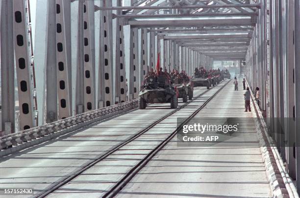 Convoy of Soviet Army armoured personnel vehicles cross a bridge in Termez at the Soviet-Afghan border, during the withdrawal of the Red Army from...