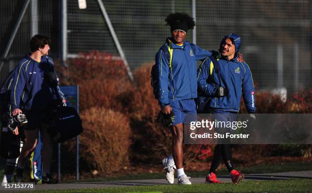 Wallabies players Radike Samo and Digby Ioane get wrapped up against the cold weather as they make their way to Australia training at Treforest on...