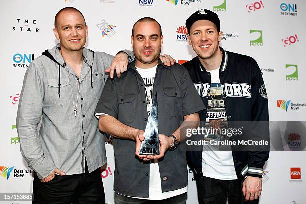 Hilltop Hoods poses with the ARIA for best Urban release at the 26th Annual ARIA Awards 2012 at the Sydney Entertainment Centre on November 29, 2012...