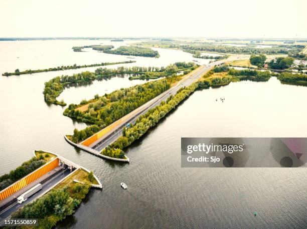 aqueduct veluwemeer in the veluwe lake with a boat sailing in the canal - veluwemeer bildbanksfoton och bilder