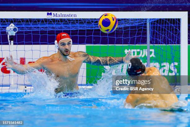 Emmanouil Zerdevas of Greece, Denes Varga of Hungary during the World Aquatics Championships 2023 Men's Waterpolo Gold Medal match between Greece and...