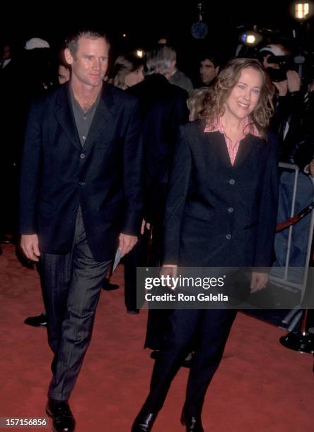 Actress Catherine O'Hara and husband Bo Welch attend the "Mars Attack" Hollywood Premiere on December 12, 1996 at Mann's Chinese Theatre in...