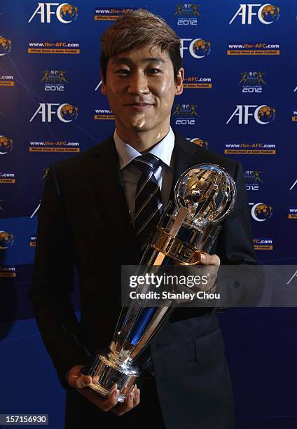 Lee Keun-ho of South Korea poses with the 2012 AFC Player of the Year Award during The 2012 AFC Annual Awards at the Mandarin Oriental Hotel on...